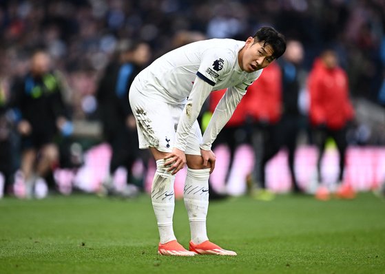 Tottenham's Son Heung-min reacts at the end of a Premier League match against Arsenal at Tottenham Hotspur Stadium in London on April 28. [REUTERS/YONHAP]