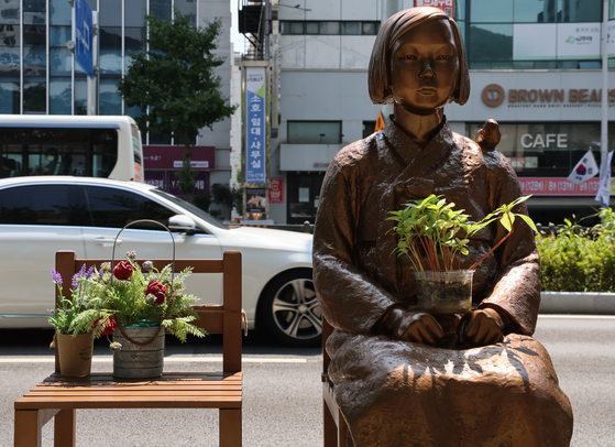 The Peace Monument, symbolizing the women forced into sexual slavery by the Japanese military during World War II, stands in front of the Japanese Consulate in Busan. [SONG BONG-GEUN]