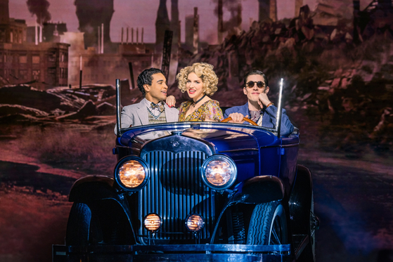 A scene from the ongoing Broadway musical "The Great Gatsby" produced by OD Company, at Broadway Theater, New York. From left are Noah J. Ricketts as Nick, Sara Chase as Myrtle and John Zdrojeski as Tom [OD COMPANY]