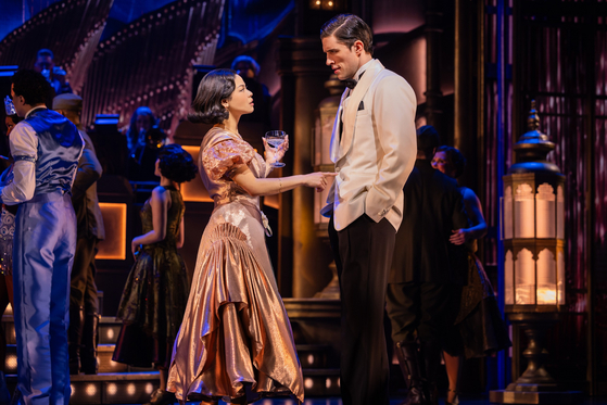 A scene from the ongoing Broadway musical "The Great Gatsby" produced by OD Company, at Broadway Theater, New York, starring Eva Noblezada, left, and John Zdrojeski ·as Tom [OD COMPANY]