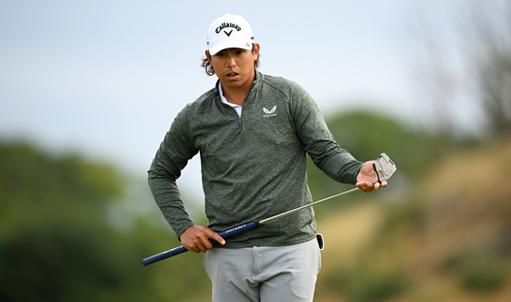 Gavin Green of Malaysia lines up a putt on the eighth green during Day 2 of the Genesis Scottish Open at The Renaissance Club on July 14, 2023 in England. [GETTY IMAGES]