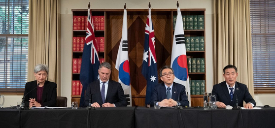 From left, Australian Foreign Minister Penny Wong, Defense Minister Richard Marles, Korean Foreign Minister Cho Tae-yul and Defense Minister Shin Won-sik speak during a press conference after the two plus two meeting in Melbourne on Wednesday. [YONHAP]