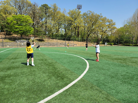 Mary tries to mimic proper passing technique. [MARY YANG]