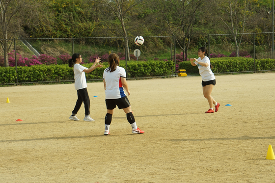 What looks like a game of beach volleyball is actually one of the building blocks for proper football technique at Seoul Calcio. [SEOUL CALCIO FC]
