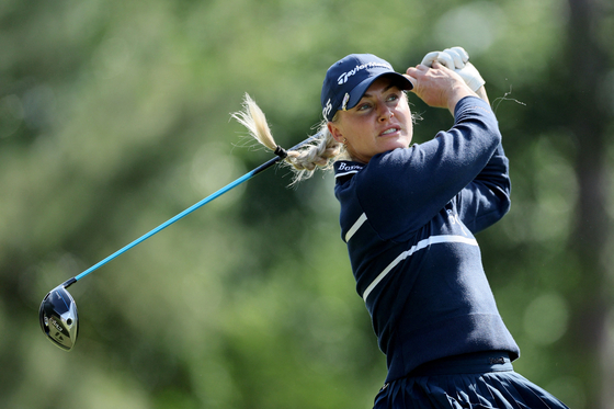 Charley Hull hits her shot from the second tee during the first round of The Chevron Championship at The Club at Carlton Woods in The Woodlands, Texas on April 18. [AFP/YONHAP]