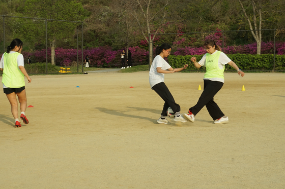 Mary, left, unintentionally reverts to some of her youth league tactics — creating space as an excuse to avoid the action. [SEOUL CALCIO FC]