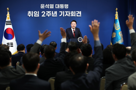 President Yoon Suk Yeol takes questions from journalists during a press conference to mark his second anniversary in office at the Yongsan presidential office Thursday. [NEWS1] 