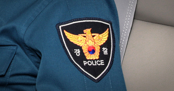 A police patch on an officer's uniform [YONHAP]