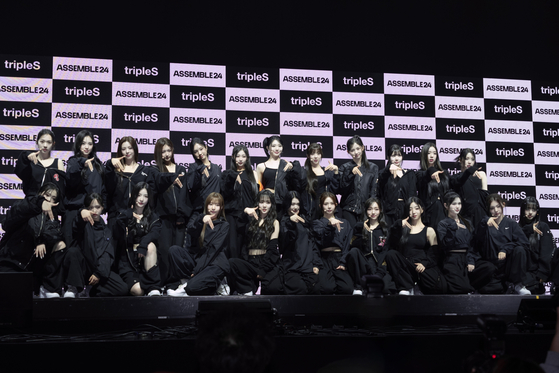 Twenty-four member girl group tripleS poses for the camera during a showcase for the group's first full-length album "Assemble24," held at the Yes24 Live Hall in eastern Seoul on Wednesday afternoon. [DANIELA GONZALEZ PEREZ]