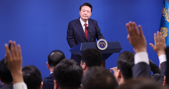 President Yoon Suk Yeol takes questions from journalists during a press conference to mark his second anniversary in office at the Yongsan presidential office Thursday. [JOINT PRESS CORPS]