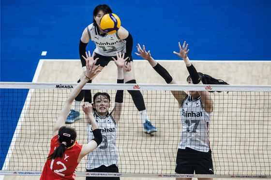 The Korean women's volleyball team, in white, in action during a 2024 Volleyball Nations League game against China in Brazil on Tuesday. [FIVB]