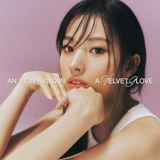Jini, a former member of Nmixx, will drop her first EP ″An Iron Hand In A Velvet Glove″ on Oct. 11. [ATOC]