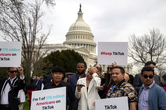 Supporters of TikTok gather near the Capitol in Washington on Wednesday, March 13, 2024. The House on Wednesday passed a bill with broad bipartisan support that would force TikTok’s Chinese owner to either sell the hugely popular video app or be banned in the United States. [Kent Nishimura/The New York Times]