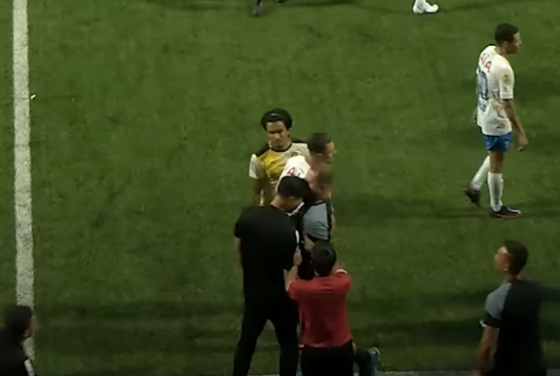 A still from the official match report video shared by the Singapore Premier League on YouTube appears to show Lion City Sailors manager Kim Do-hoon, bottom left in black, headbutting Tampines Rovers assistant coach Mustafic Fahrudin on the sidelines of a game on Sunday. [SCREEN CAPTURE]