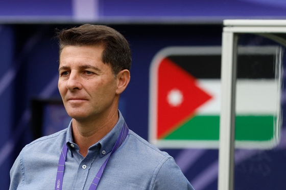 Iraqi national team manager Jesus Casas watches an AFC Asian Cup match against Jordan at Khalifa International Stadium in Doha on Jan. 29, 2024. [AFP/YONHAP] 