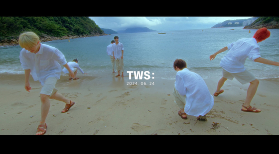 The number ″24.06.24″ is juxtaposed with the image of boy band TWS running toward the beach at the end of the 39 second video. [PLEDIS ENTERTAINMENT]
