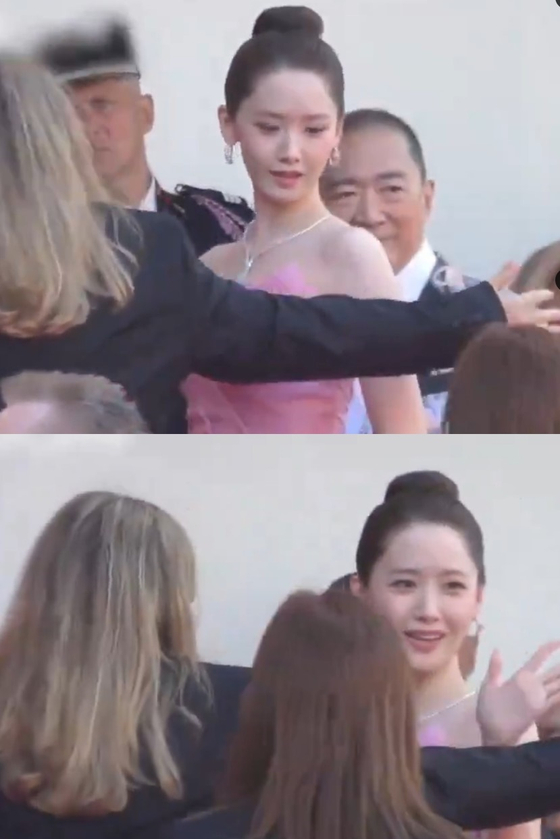Screen captured images from a video of a guard allegedly rushing Yoona into the venue. [SCREEN CAPTURE]