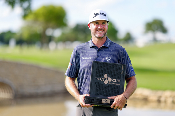 Taylor Pendrith poses with the tournament trophy after winning The CJ Cup Byron Nelson at TPC Craig Ranch in McKinney, Texas on May 5. [GETTY IMAGES] 