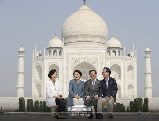 In this photo taken on Nov. 7, 2018, then-first lady Kim Jung-sook, second from left, smiles as she poses for a photograph in front of the Taj Mahal in Agra, India alongside then-Culture Minister Do Jong-hwan, second from right. Shin Bong-gil, Korea's ambassador to India at the time, is on the far right, while his wife Hwang Mee-sook sits on the far left. [BLUE HOUSE]
