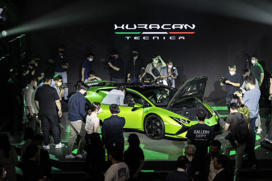 People take a photo of the Lamborghini Huracán Tecnica at the release event held in July, 2022. [AUTOMOBILI LAMBORGHINI]