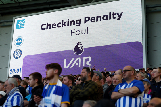 A general view of the big screen during a VAR review before a penalty is overturned during a Premier League match between Chelsea and Brighton & Hove Albion at the American Express Community Stadium in Brighton, England on May 15. [REUTERS/YONHAP] 