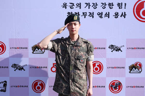 Jin completes his military service and was discharged from the ROK Army 5th Infantry Division Recruit Training Center in Yeoncheon County, Gyeonggi at around 8:50 a.m. on June 12. [BIGHIT MUSIC]