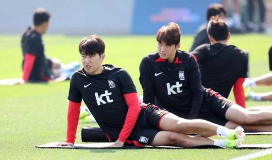 Lee Kang-in, front, and Kim Ji-soo train ahead a match against Bahrain at the 2023 AFC Asian Cup at the Al Egla Training Center in Doha, Qatar on Jan. 11. [NEWS1] 
