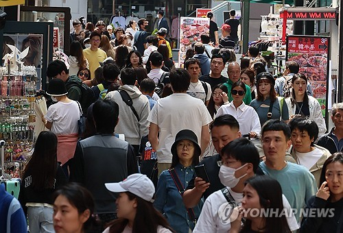 Foreign tourists crowd the popular shopping district of Myeongdong in central Seoul, in this file photo taken May 1, 2024. [YONHAP]