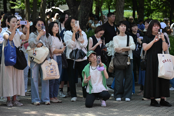 Fans of boy band BTS attend the 2024 Festa event in southern Seoul on June 13, a day after member Jin was discharged from his military service. [AFP/YONHAP]