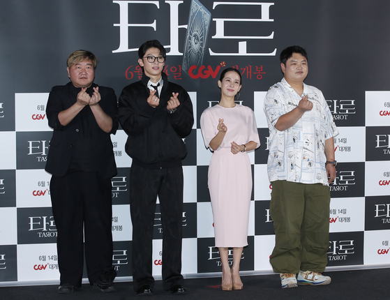 From left, producer Choi Byung-gil, actors Kim Jin-young, Cho Yeo-jeong and Ko Kyu-phil pose for a photo at a press conference for the upcoming film ″Tarot″ in Yongsan District, central Seoul, on Wednesday. [NEWS1]
