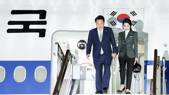 President Yoon Suk Yeol, left, and first lady Kim Keon Hee disembark from the presidential jet at Seoul Air Base in Seongnam, Gyeonggi, early Sunday, concluding a weeklong trip to Turkmenistan, Kazakhstan and Uzbekistan. [JOINT PRESS CORPS]
