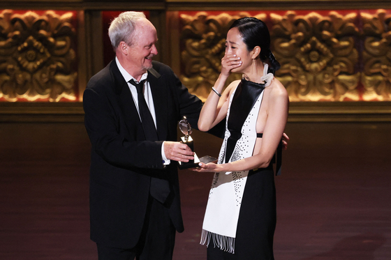 Theater designer and visual artist Hana S. Kim, right, and Brian MacDevitt won Best Lighting Design in a Musical for “The Outsiders” during the 2024 Tony Awards on Monday. [REUTERS/YONHAP]