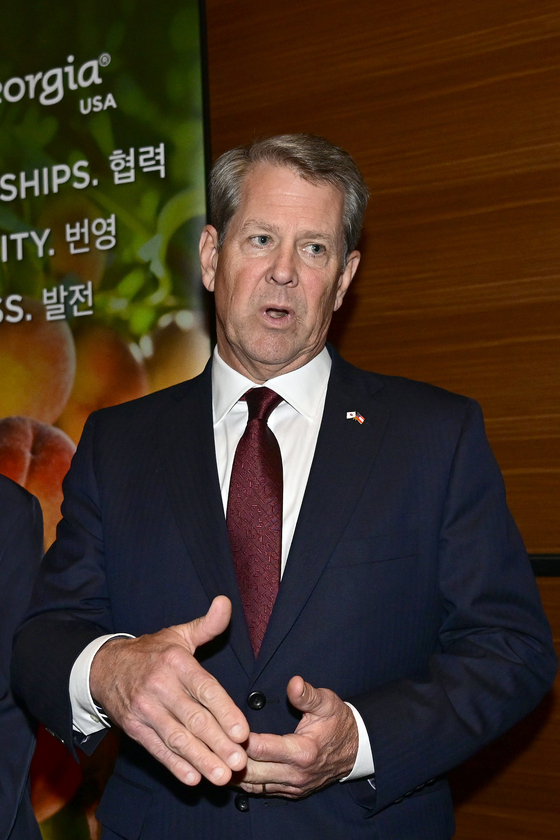 Georgia Gov. Brian Kemp, center, talks during an interview with the Korea JoongAng Daily at the "Georgia Night" event held at the Conrad Seoul in western Seoul on Monday. [HYUNDAI MOTOR] 