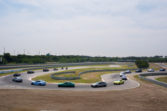 BMW cars run on a track at the company's driving center in Incheon on Thursday. [BMW KOREA]