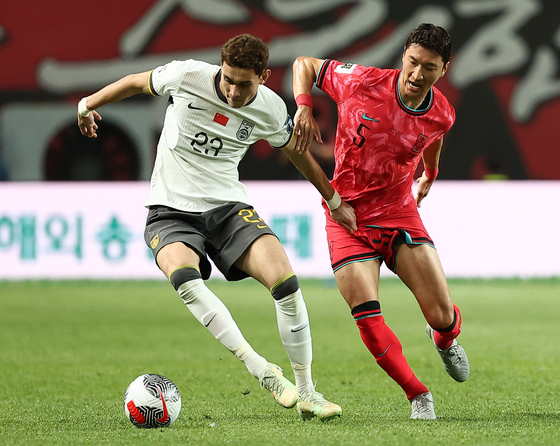 Korea's Jung Woo-young, right, in action during a 2026 World Cup qualifier agaisnt China at Seoul World Cup Stadium in western Seoul on June 11. [YONHAP] 