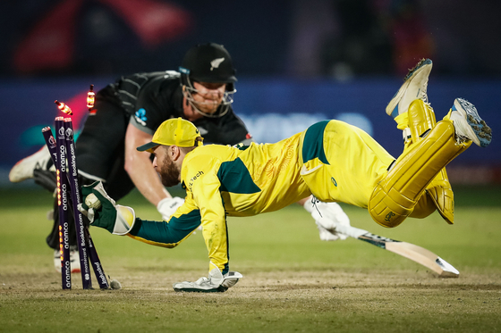 This image, taken during a game between Australia and New Zealand at the ICC Men's Cricket World Cup 2023 in Dharamsala, India, by photographer Darrian Traynor won the CRICKET category at the 2024 World Sports Photography Awards.  [DARRIAN TRAYNOR]