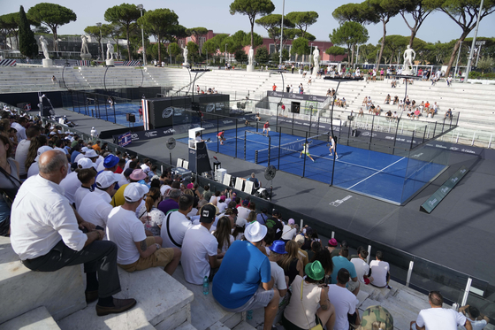 Spectators watch a match at the Italy Major Premier Padel tournament in Rome on July 12, 2023. [AP/YONHAP]