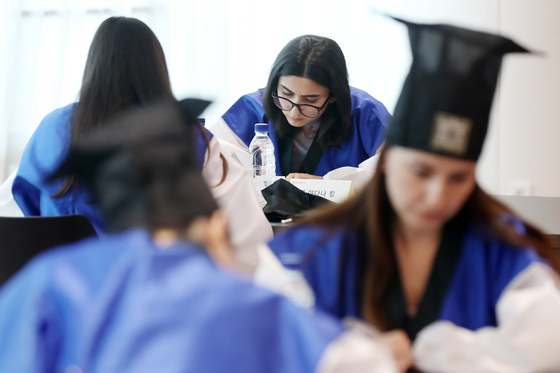 Sungkyunkwan University students participate in a Korean writing contest in August last year. The university was one of the top five universities with the largest number of international students as of 2023. [NEWS1]