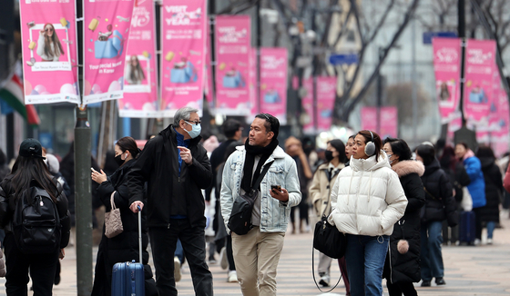 A street in Myeong-dong, central Seoul, bustles with pedestrians including foreign tourists on January 11, during the 2024 Korea Grand Sale shopping and tourism festival. [NEWS1] 