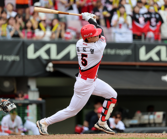 Kia Tigers infielder Kim Do-yeong hits a home run at the top of the fourth of a game between the Tigers and the Hanwha Eagles at Gwangju-Kia Champions Field in Gwangju on June 23.  [YONHAP]