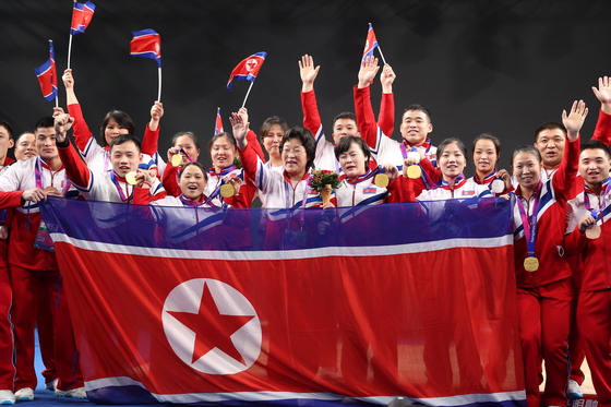 North Korean weightlifters pose for a photo after the women's 76 kilograms at the Hangzhou Xiaoshan Sports Centre in China on Oct. 5, 2023. [YONHAP] 