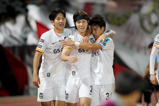 Hwang Hyun-soo, center, celebrates scoring a goal during a 2024 Korea Cup match between FC Seoul and Seoul E-Land at Mokdong Sports Complex in western Seoul in a photo shared on FC Seoul's official Facebook account on April 17. [SCREEN CAPTURE]