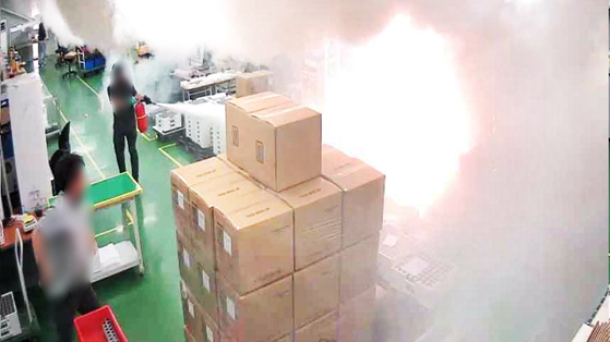 Internal CCTV footage from the lithium battery manufacturing plant of Aricell in Hwaseong captures the progression of the fire. [SCREEN CAPTURE]