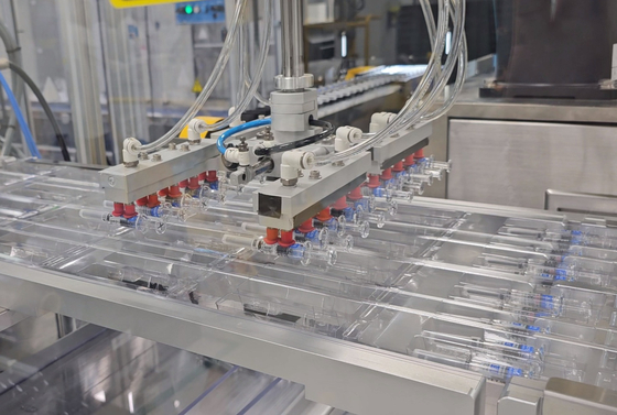 Pre-filled syringes of the SKYCellflu influenza vaccine on the packaging line at SK bioscience’s Andong L House manufacturing plant in North Gyeongsang. [SHIN HA-NEE]