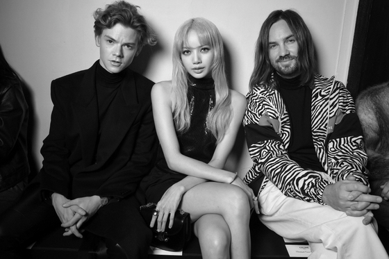 From left, Thomas Brodie Sangster, Blackpink's Lisa and Kevin Parker at Celine's Spring Summer 2023 Menswear Collection in Paris in 2022 [CELINE]