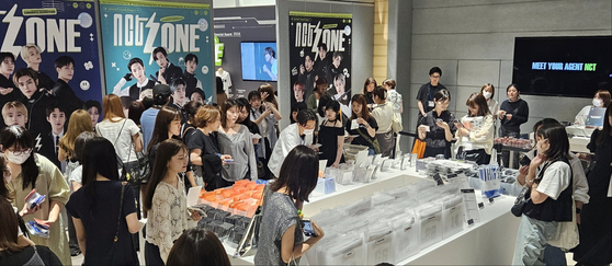 Visitors fill the NCT Zone pop-up store at the Parco department store in Shibuya, Tokyo. [TAKEONE COMPANY]