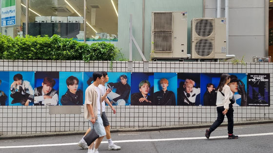 Posters of boy band INI hung up in Shibuya, Japan, on June 25 [YOON SO-YEON]