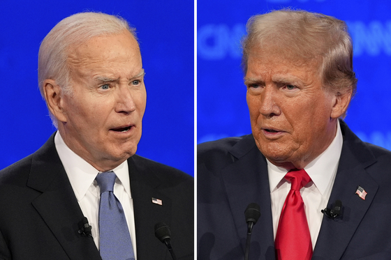 U.S. President Joe Biden, left, and Republican presidential candidate former President Donald Trump speak during a presidential debate hosted by CNN on Thursday (local time) in Atlanta. [AP/YONHAP]