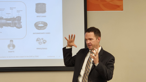 Nate Minami, head of business at Hanwha Aerospace USA, explains engine parts during a media tour of the company's manufacturing facility in Cheshire, Connecticut on June 25. [HANWHA AEROSPACE USA]