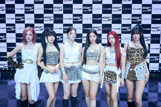 Girl group STAYC poses for the camera during the group's Monday showcase [HIGH UP ENTERTAINMENT]
